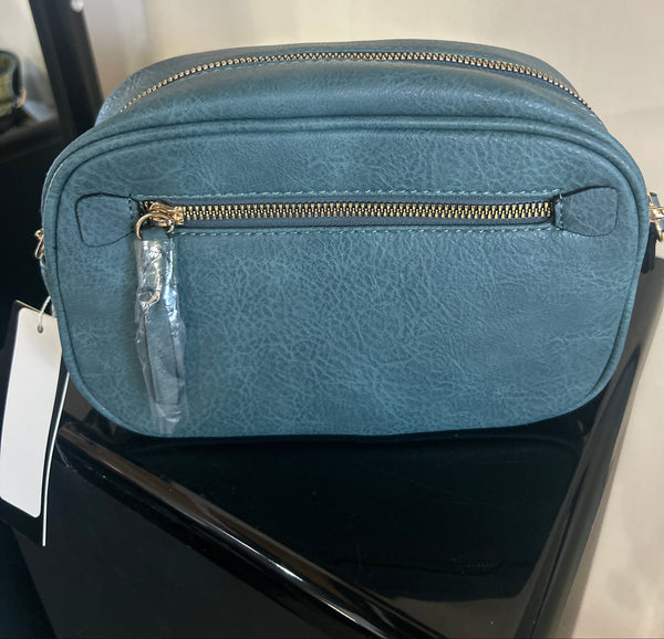 Blue cross body purse with guitar strap