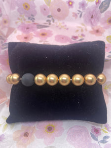 Large Gold Tone Stretch Bracelet w Black Clay Bead