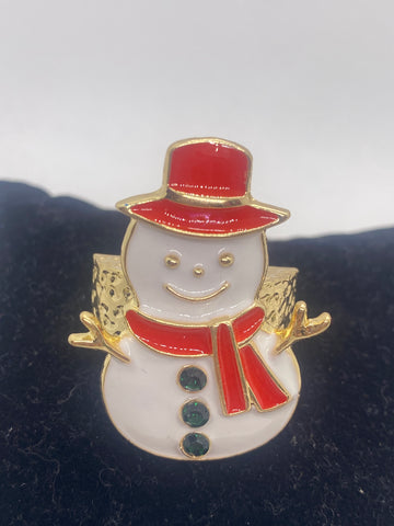 Snowman-shaped Stretch Ring  with red top hat and bow tie on a dark background