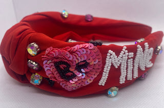 Red Valentines Day headband with white lettering and colorful embellishments on a white background