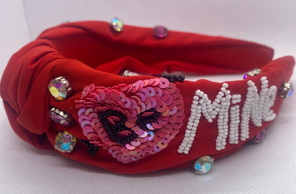 Red Valentines Day headband with white lettering and colorful embellishments on a white background