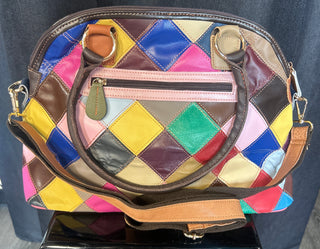 Multicolored patchwork bag on a dark surface