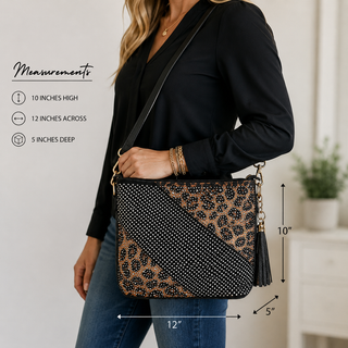 A woman wearing a black long-sleeve top and blue jeans carries a black crossbody bag with a leopard print panel, black polka-dot pattern, and a black tassel. Measurement annotations on the left show the bag's dimensions: 10 inches high, 12 inches across, and 5 inches deep.