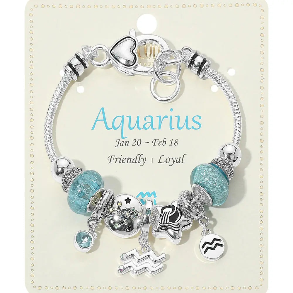 Bracelet with charms on a card labeled 'Aquarius' with details about the zodiac sign.