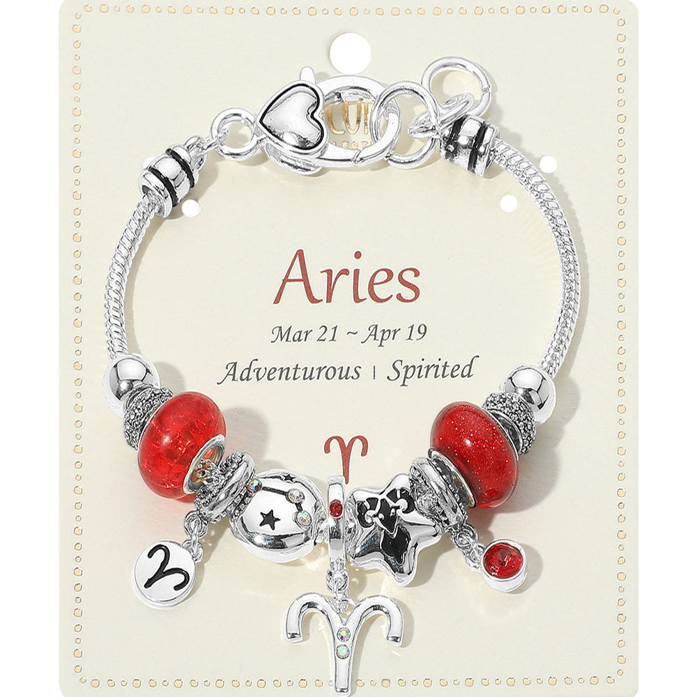 Bracelet with Aries-themed charms on a display card