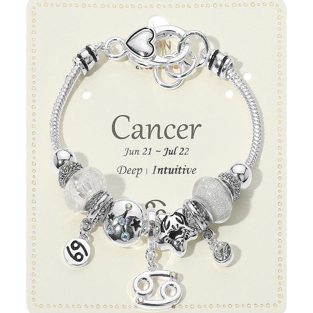 Silver bracelet with charms on a card indicating 'Cancer' zodiac sign
