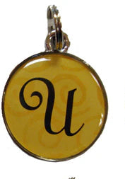 Six colorful pendant charms with the letter 'u' on a white background
