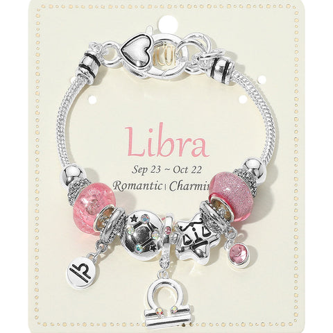 Bracelet with Libra charm on a branded card