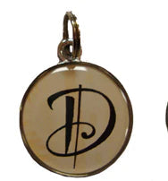 Five decorative pendants with letter 'd' designs on a white background