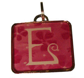 Three square pendants with letters 'E' on a white background