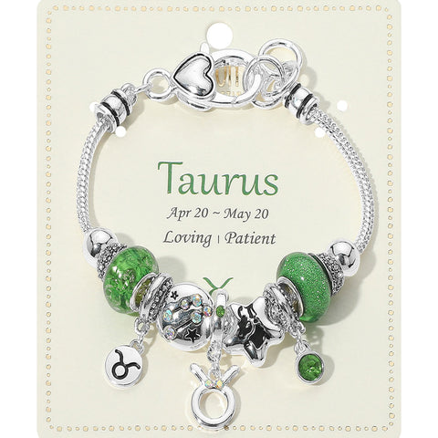 Bracelet with green beads and charms on a Taurus themed card
