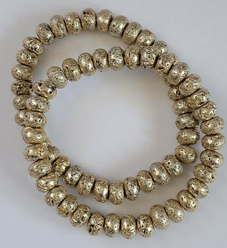 Gold Tone Metallic Oblong Lava Bead Stretch Bracelet