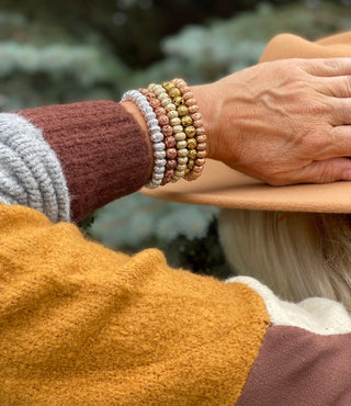 Gold Tone Metallic Oblong Lava Bead Stretch Bracelet